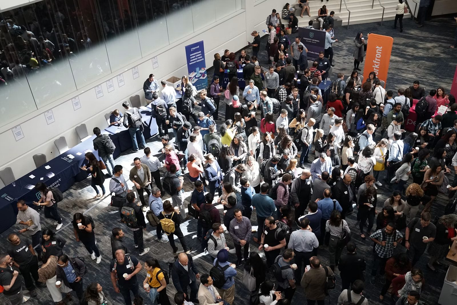 A large exhibition floor busy with visitors