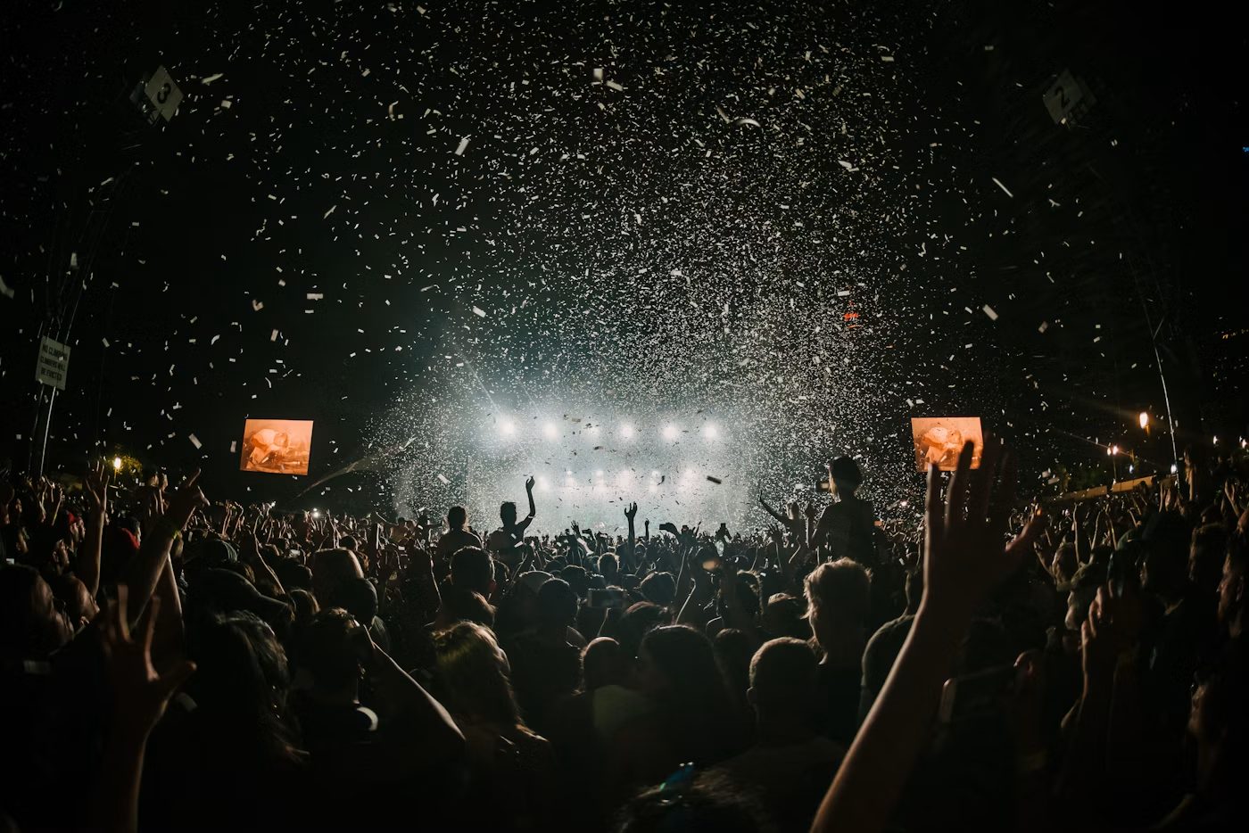 A warmly lit live audience